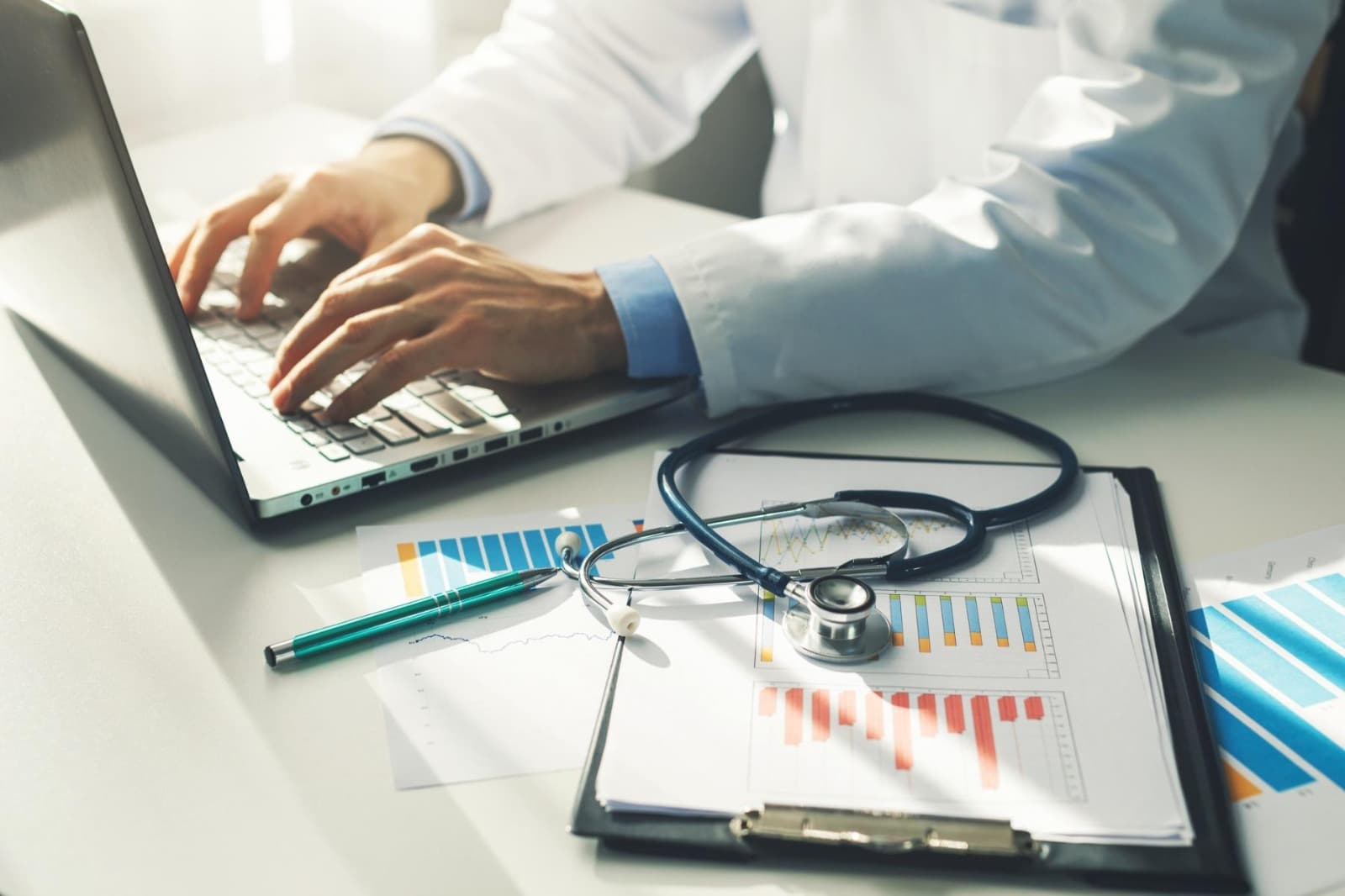 Clinical operations workspace with integrated healthcare monitoring systems illustrating the transition from fragmented spreadsheet management to structured Magnet readiness infrastructure